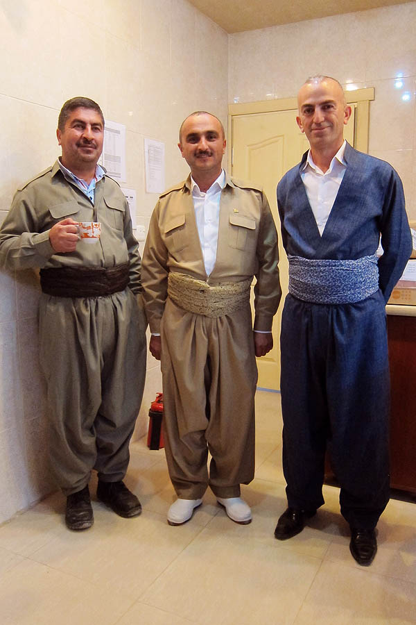 Salih, Ziyad, and Dilovan in traditional Kurdish dress